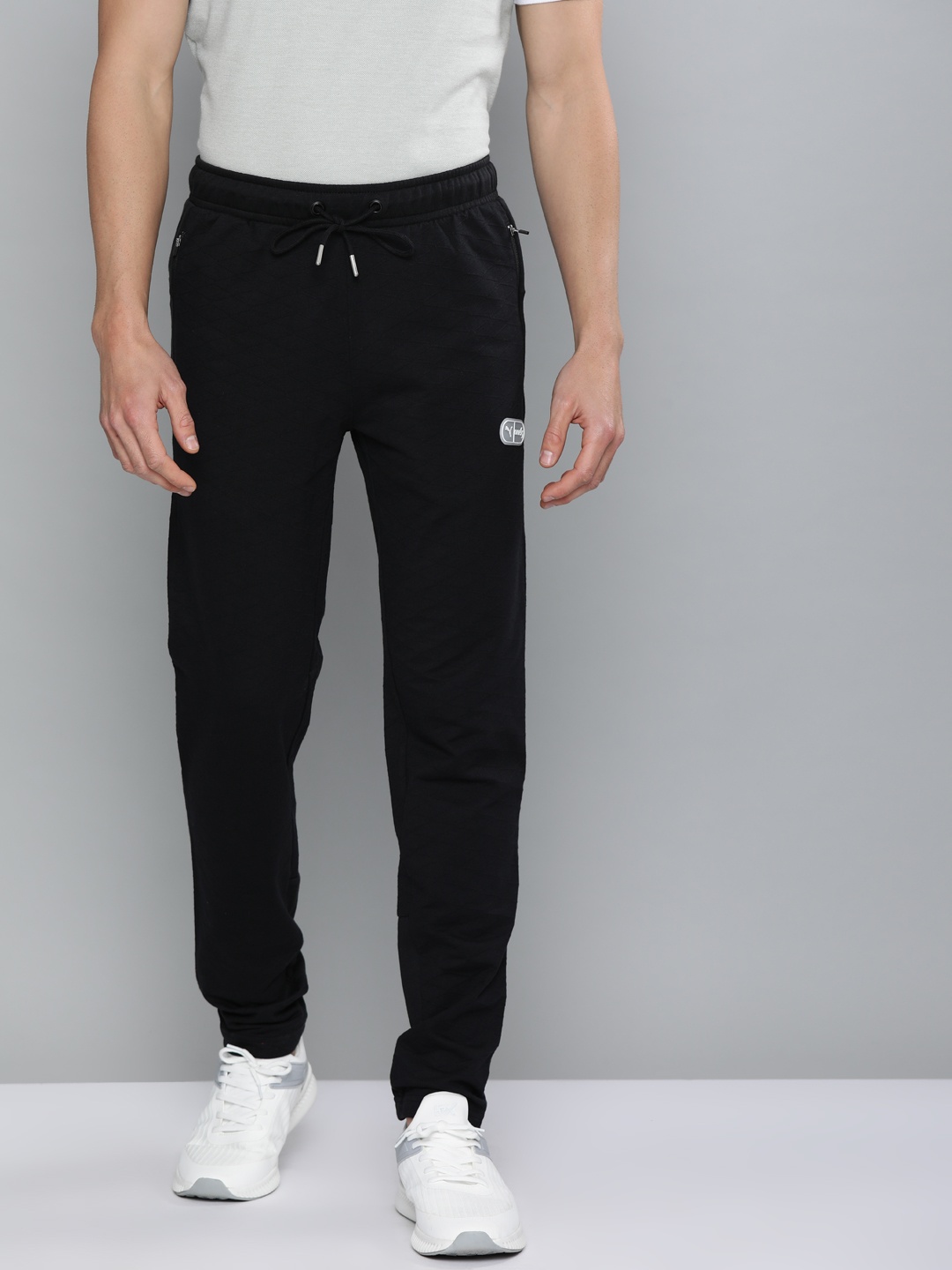 

one8 x PUMA Men Slim Fit Self Design VK Sweat Pants, Black