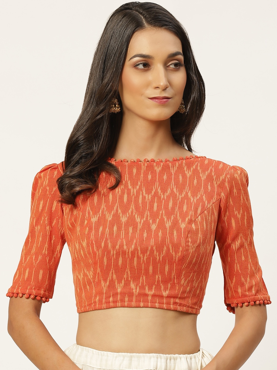 

Studio Shringaar Women Orange Ikat Printed Pure Cotton Saree Blouse With Pom Pom Details