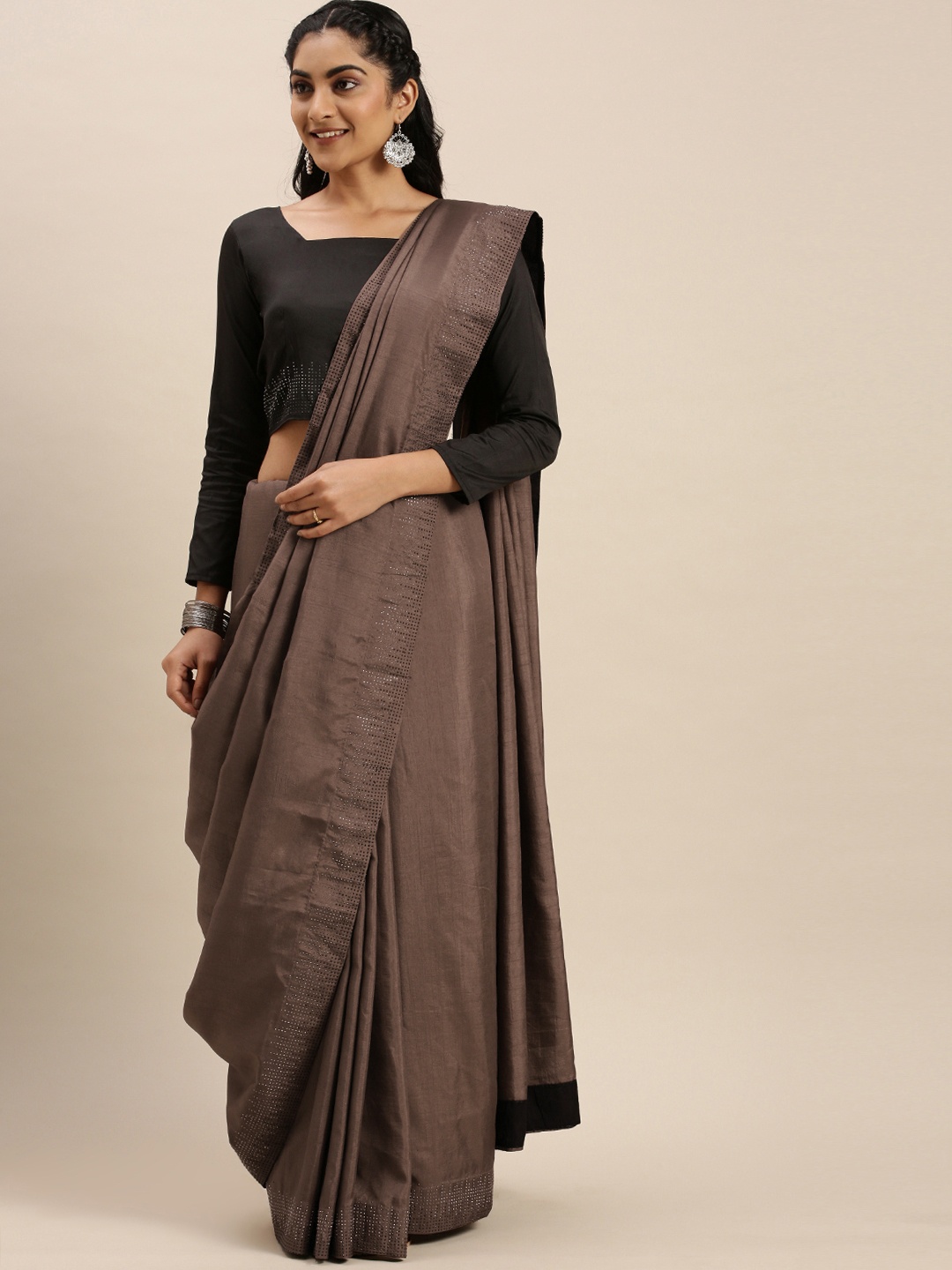 

Shaily Brown Solid Embellished Border Saree