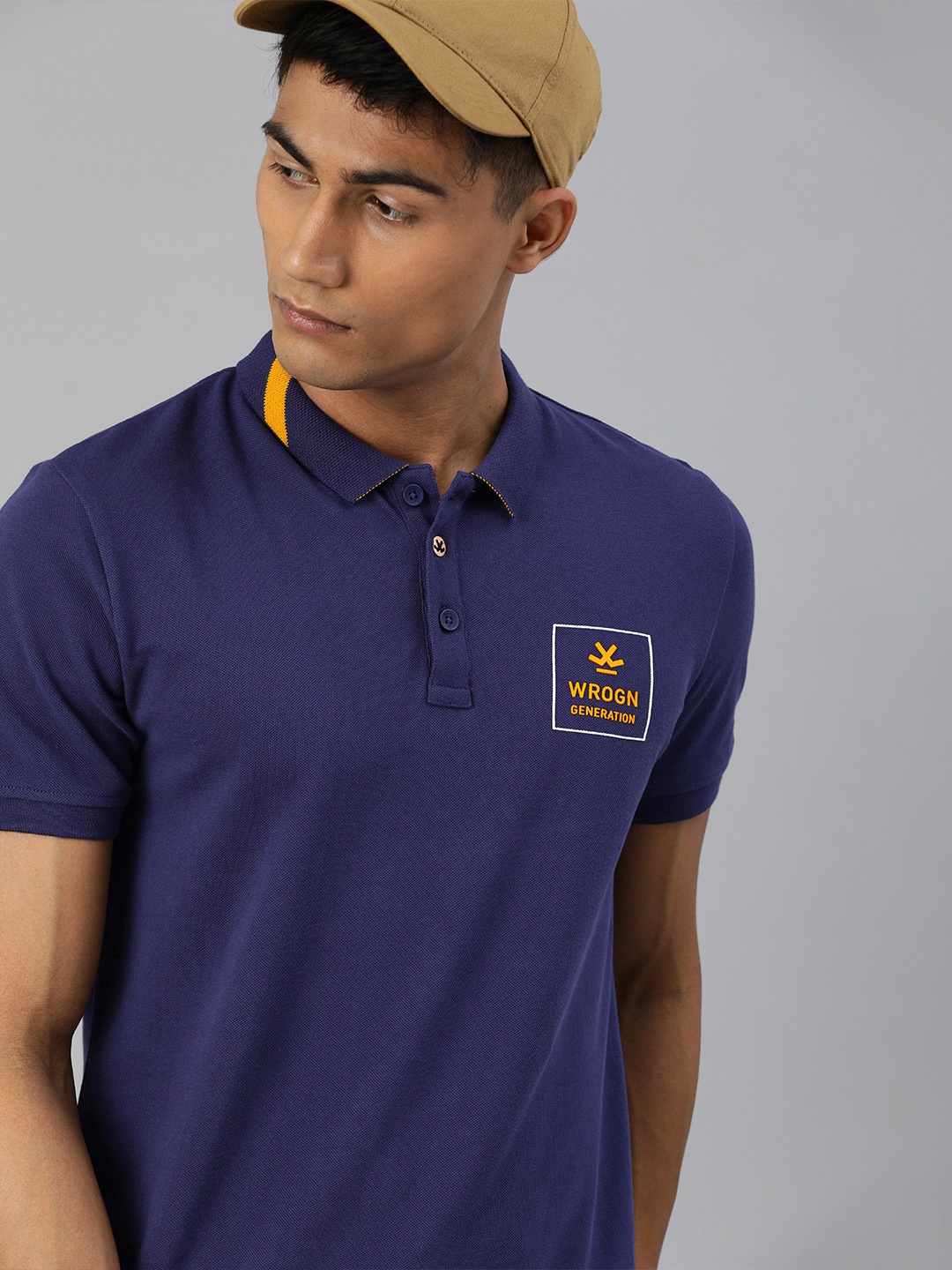 

WROGN Men Navy Blue Pure Cotton Slim Fit Solid Polo Collar Pure Cotton T-shirt with Printed Detail