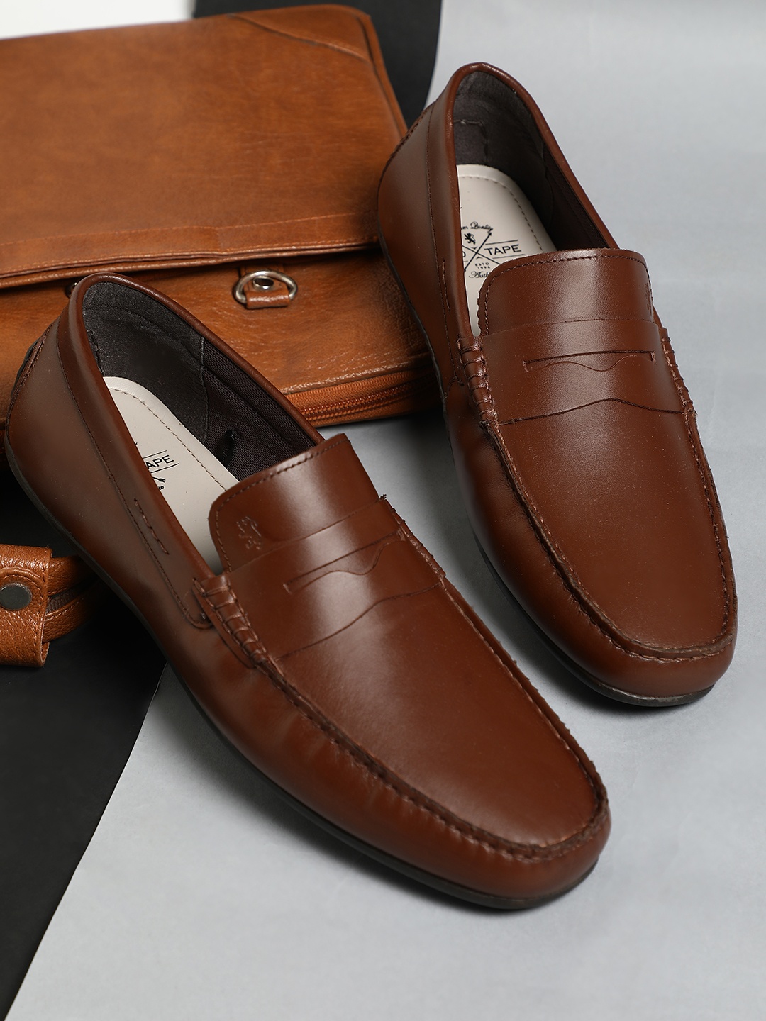 

Red Tape Men Brown Solid Loafers