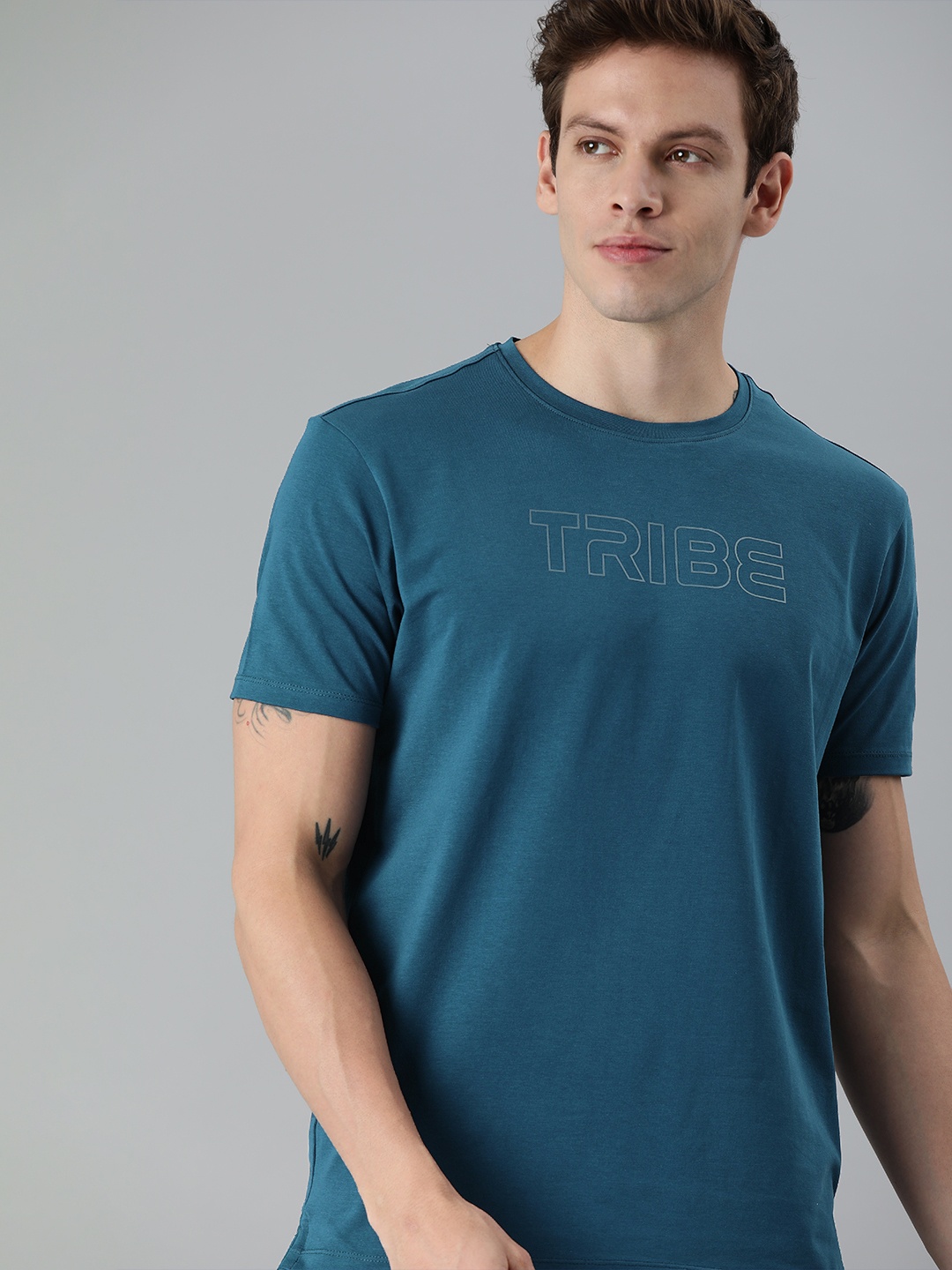 

Allen Solly Tribe Men Teal Blue Solid Round Neck T-shirt with Printed Detail