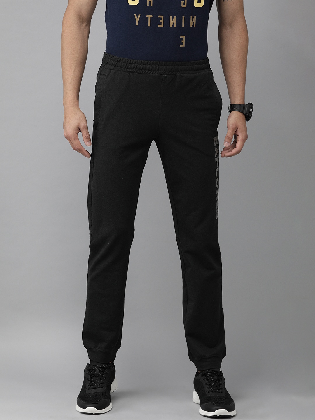 

Wildcraft Men Black Solid Joggers with Printed Detail