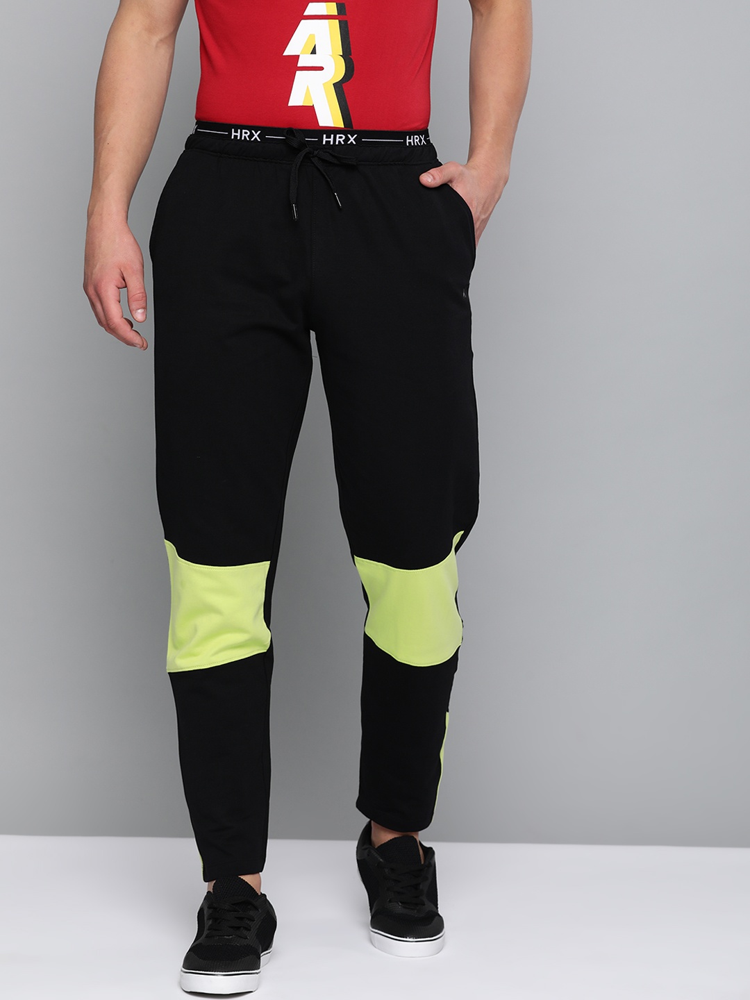 

HRX By Hrithik Roshan Men Jet Black &Wild Lime Colourblock Regular Fit Melange Bio-Wash Silicone Finish Lifestyle Track Pants