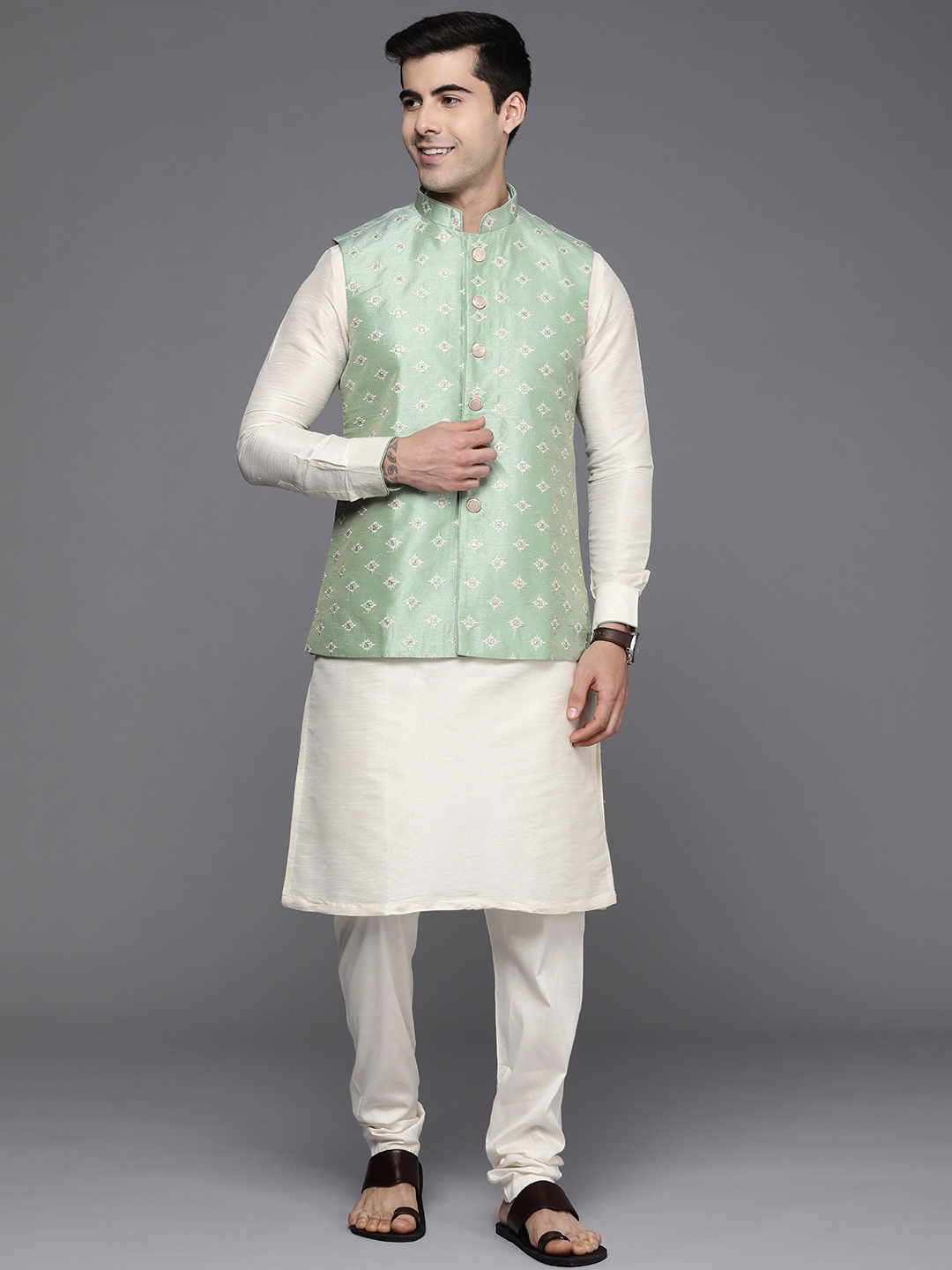 

Manyavar Men White & Green Kurta with Churidar & Nehru Jacket