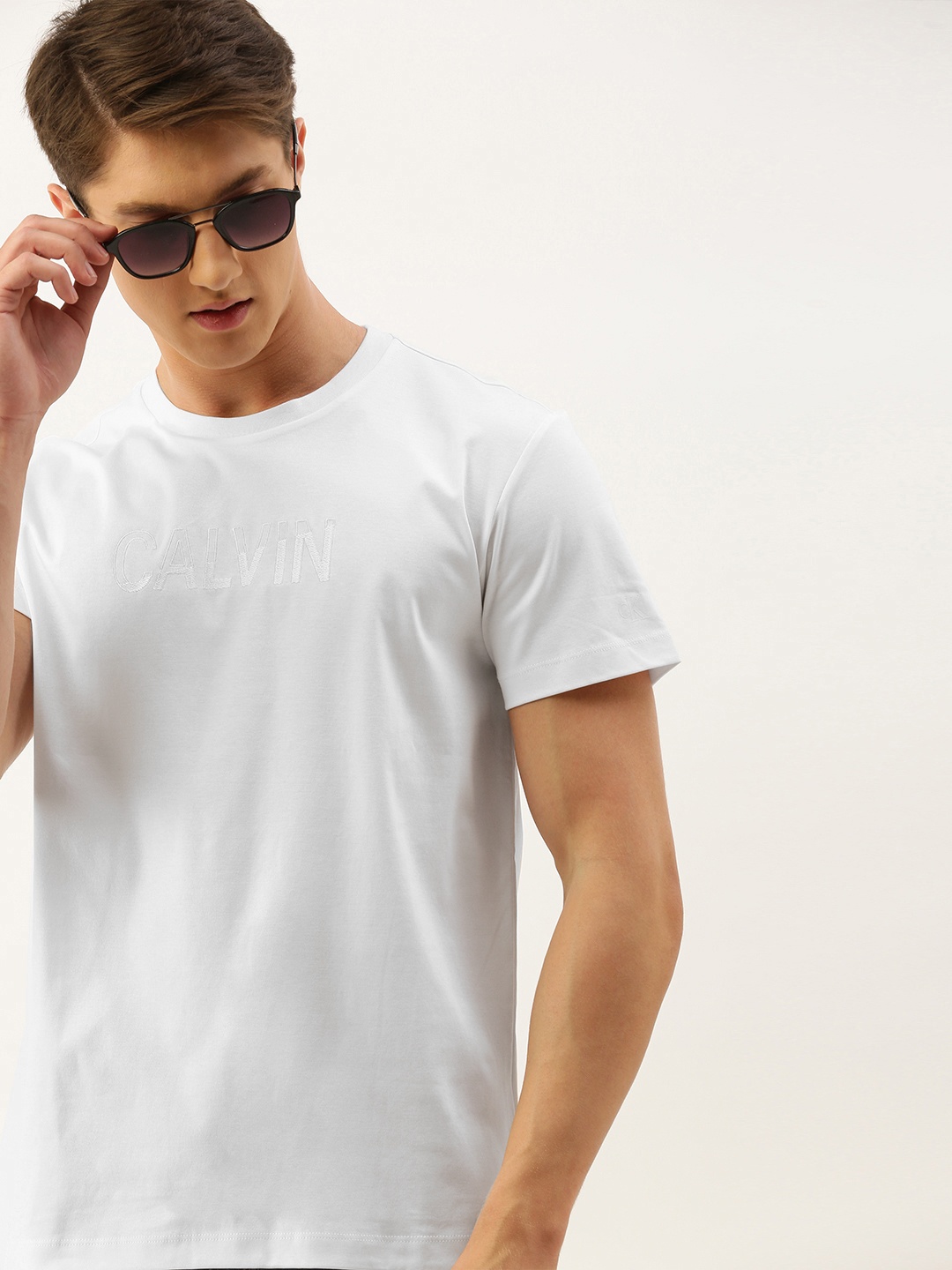 

Calvin Klein Jeans Men White Printed Round Neck Pure Cotton T-shirt