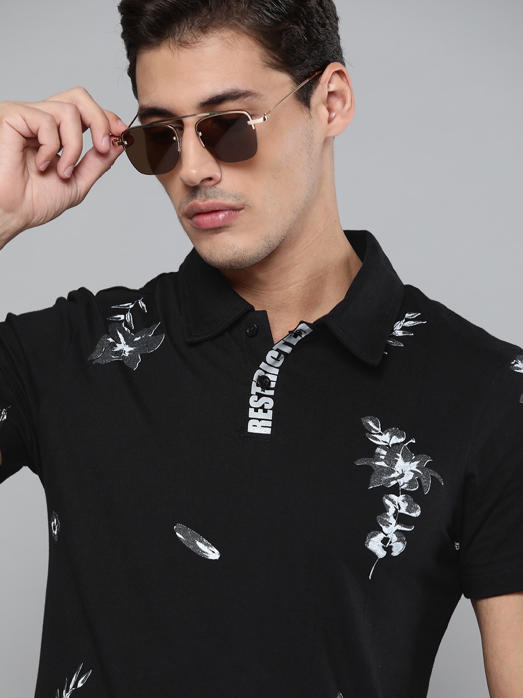 

Kook N Keech Men Black & Off-White Pure Cotton Floral Printed Polo Collar T-shirt