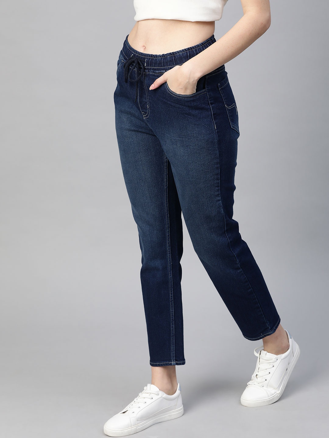 

Roadster Women Navy Blue Slim Jogger waist Fit Mid-Rise Light Fade Cropped Jeans