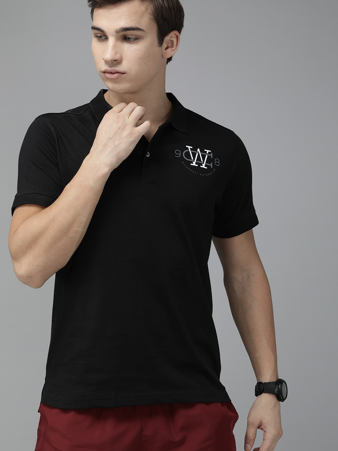 

Wildcraft Men Black Solid Polo Collar Pure Cotton T-shirt With Printed Detailing