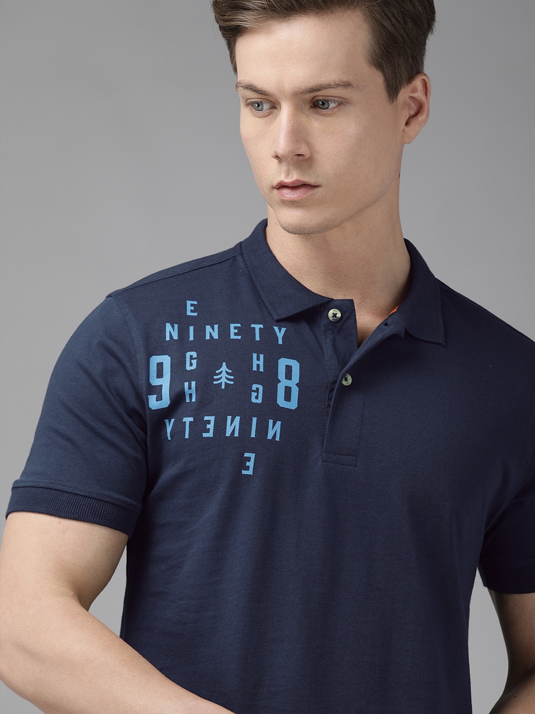 

Wildcraft Men Navy Blue Printed Polo Collar Pure Cotton T-shirt