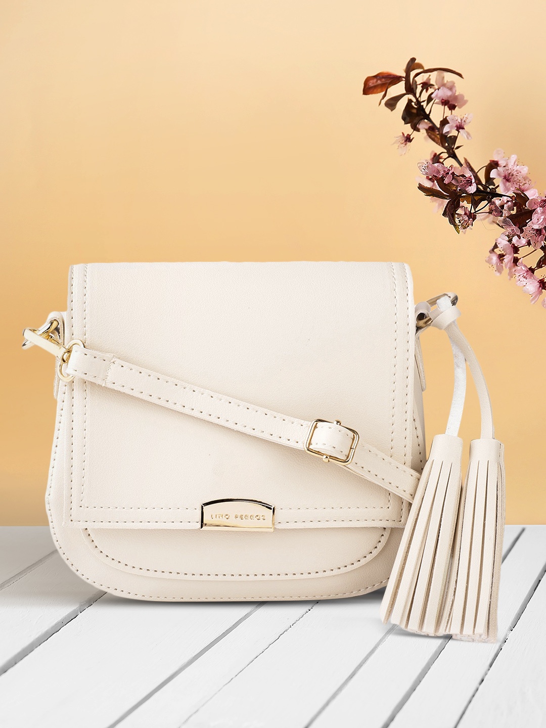 

Lino Perros Women Cream-Coloured Solid Sling Bag with Tasselled Detail