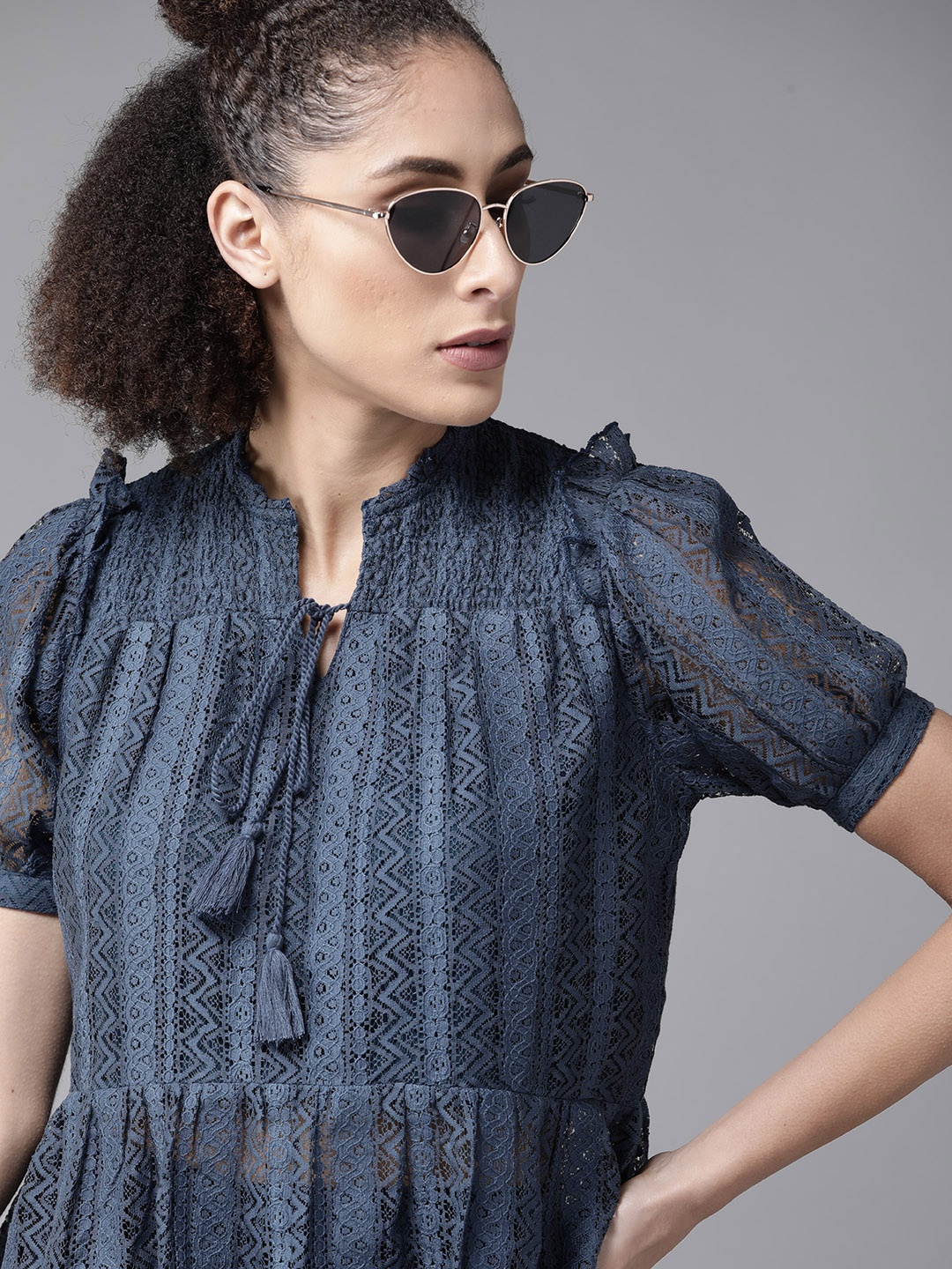 

Roadster Navy Blue Tie-Up Neck Lace Peplum Top
