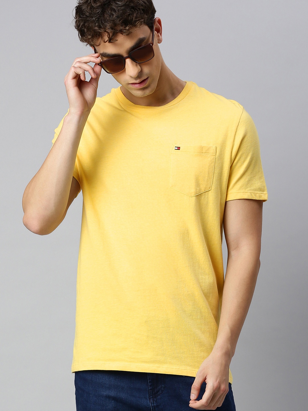 

Tommy Hilfiger Men Yellow Solid Round Neck Pure Cotton T-shirt