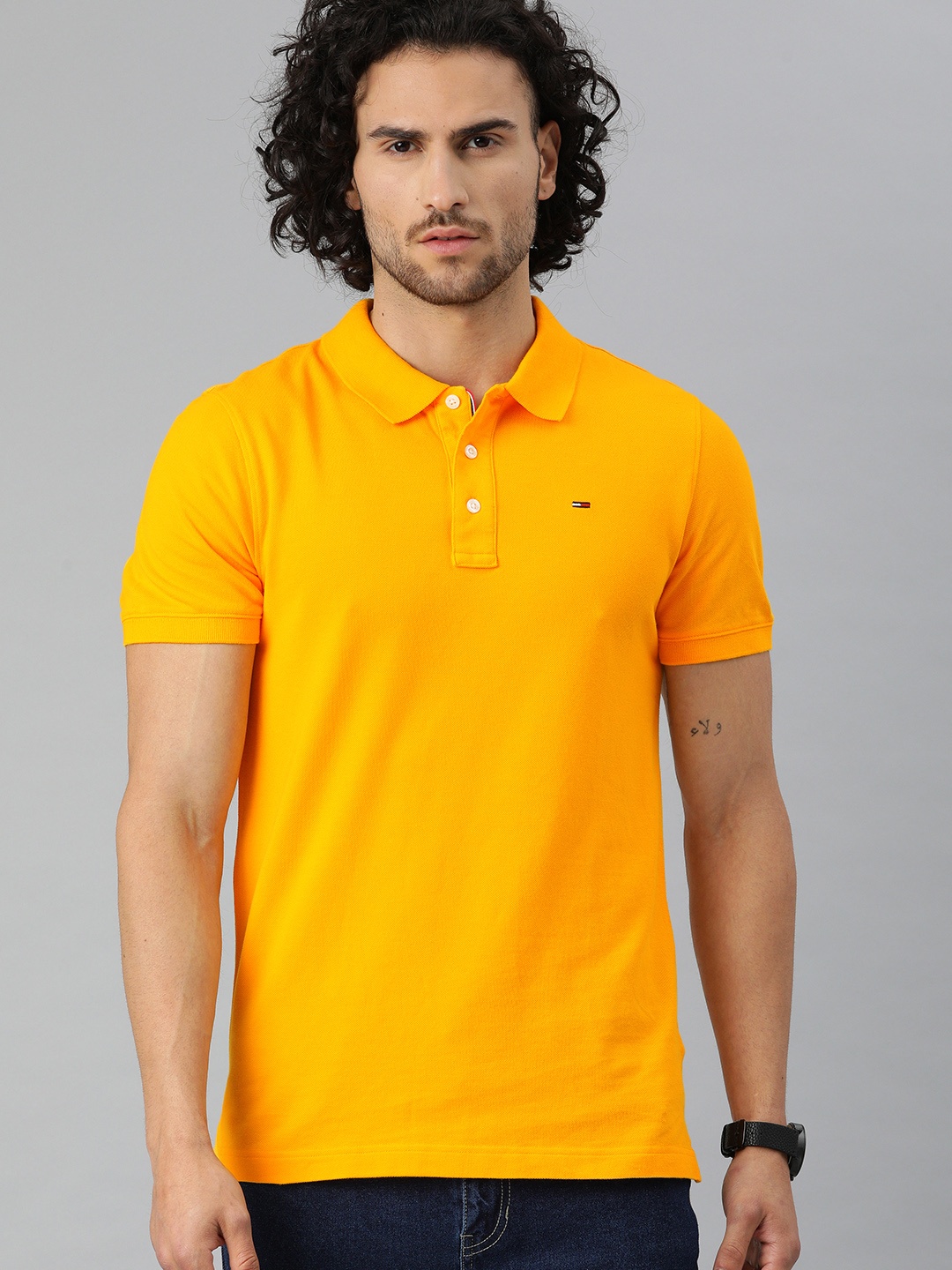 

Tommy Hilfiger Men Orange Solid Polo Collar Organic Cotton T-shirt