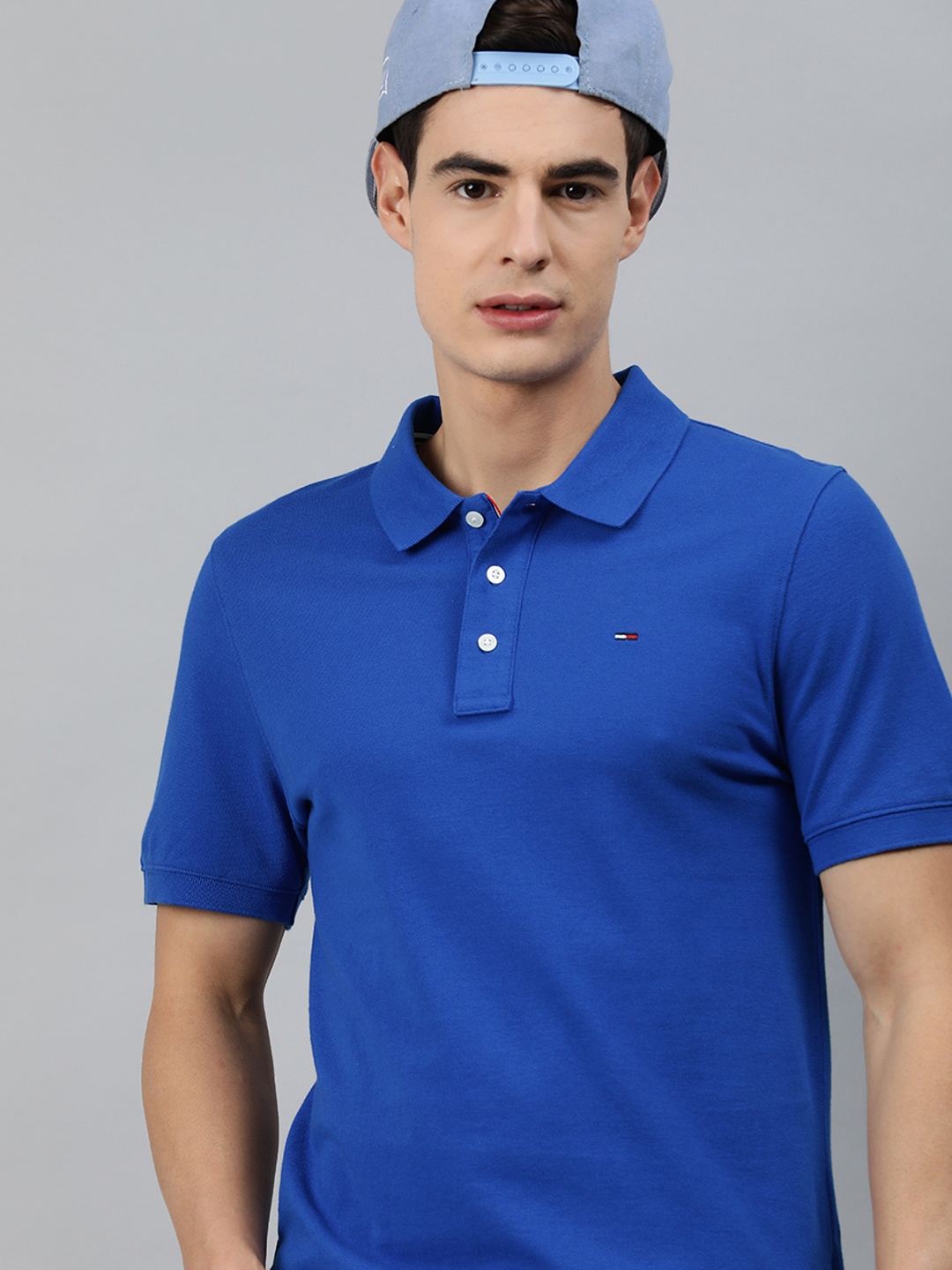 

Tommy Hilfiger Men Blue Solid Polo Collar Organic Cotton T-shirt