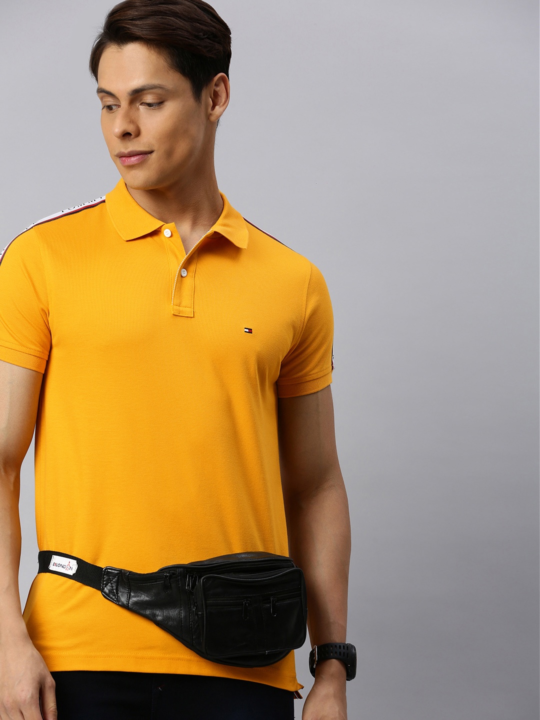 

Tommy Hilfiger Men Mustard Yellow Pure Cotton Solid Polo Collar Pure Cotton T-shirt