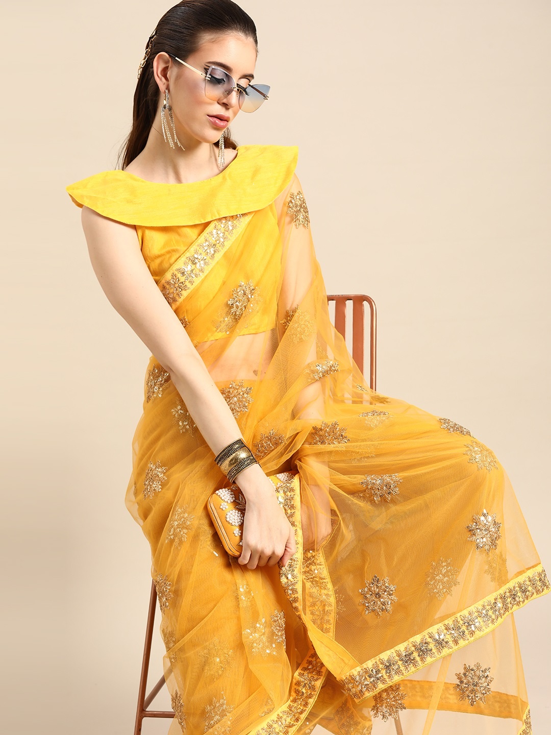 

SHAVYA Women Yellow & Golden Embellished Net Saree