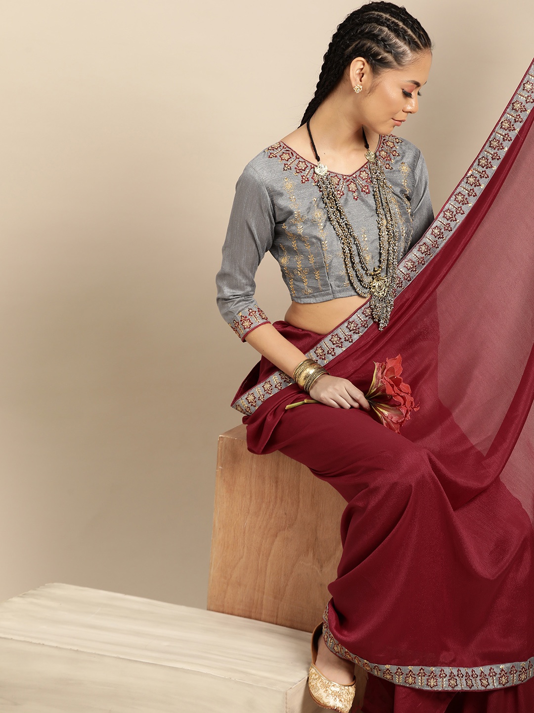 

SHAVYA Maroon Solid Celebrity Saree