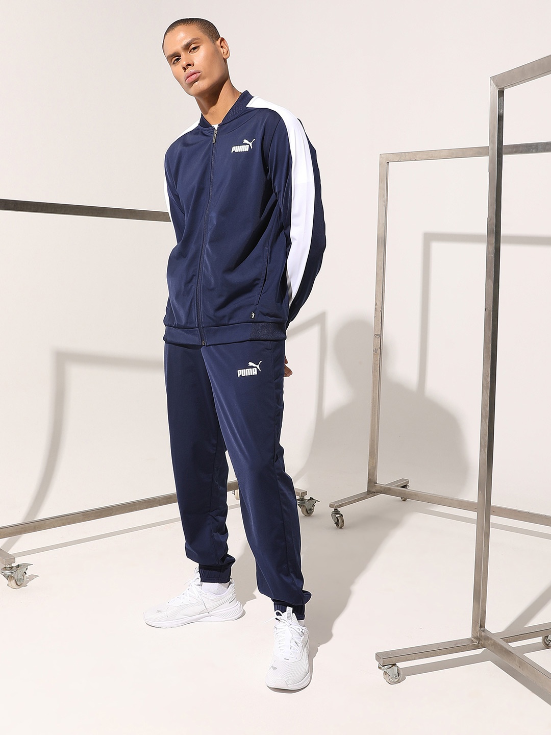 

Puma Men Navy Blue Solid Baseball Tricot Woven Sustainable Regular Fit Tracksuit
