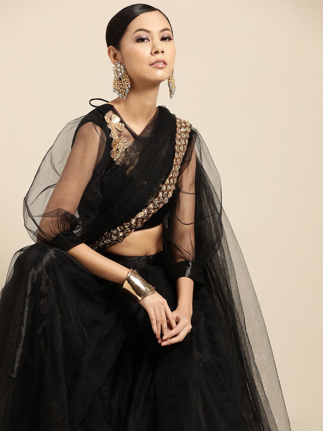 

Tikhi Imli Black Solid Net Ready To Wear Saree