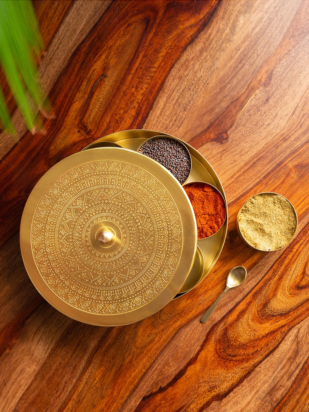 

ExclusiveLane Gold-Toned Floral-Etched Handcrafted Brass Spice Box With Spoon