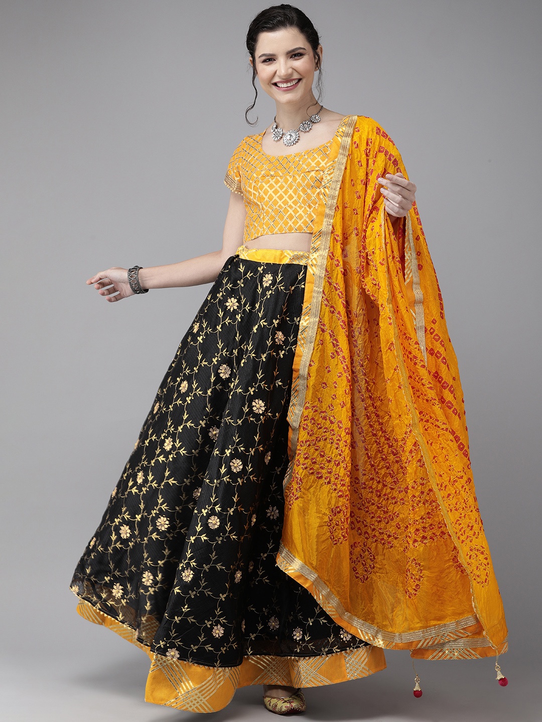 

Geroo Jaipur Hand Embroidered Black Kota Silk Sustainable Lehenga With Yellow Bandhani Dupatta