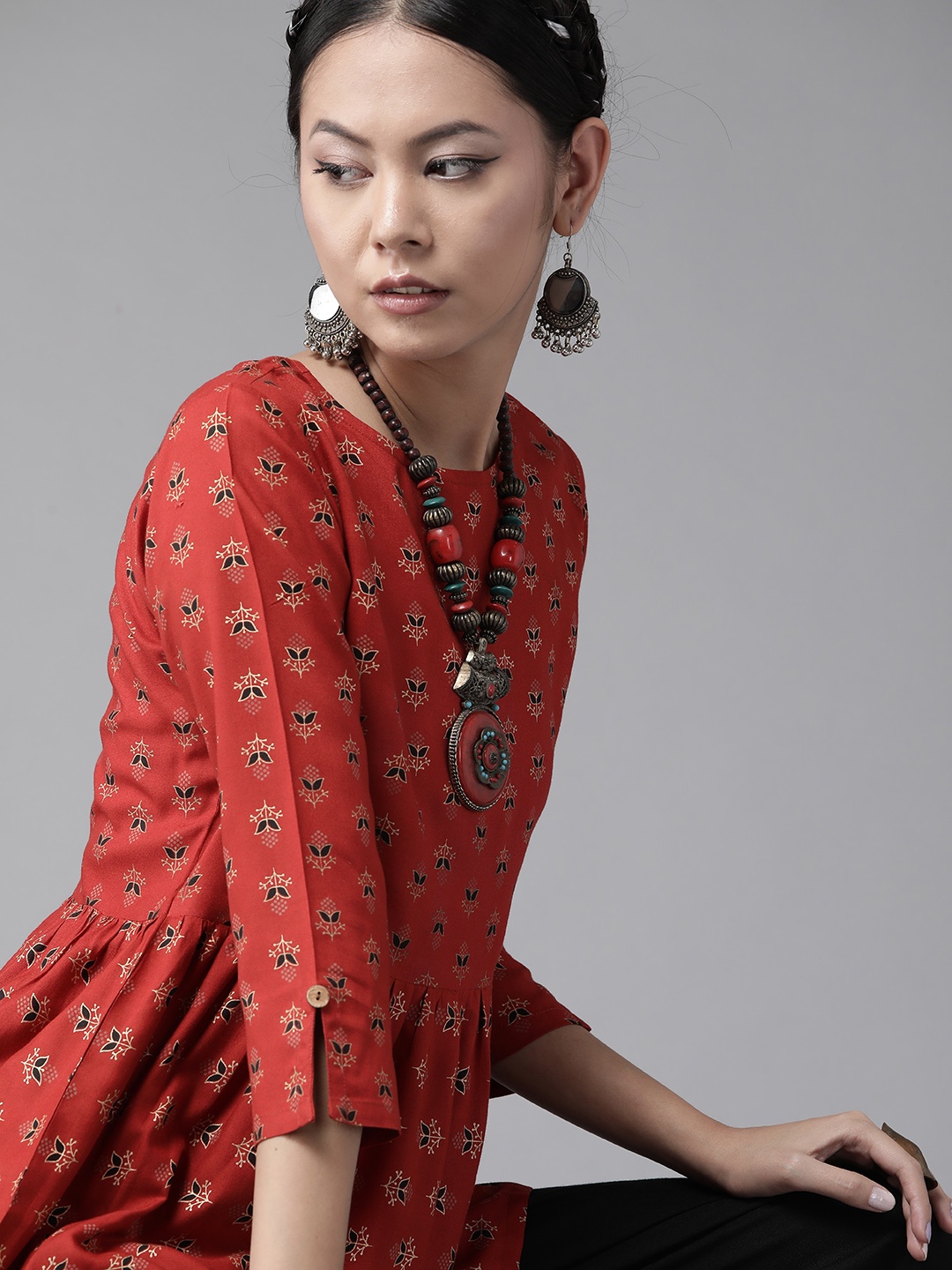 

Indo Era Women Rust Red & Black Printed Kurti with Palazzos