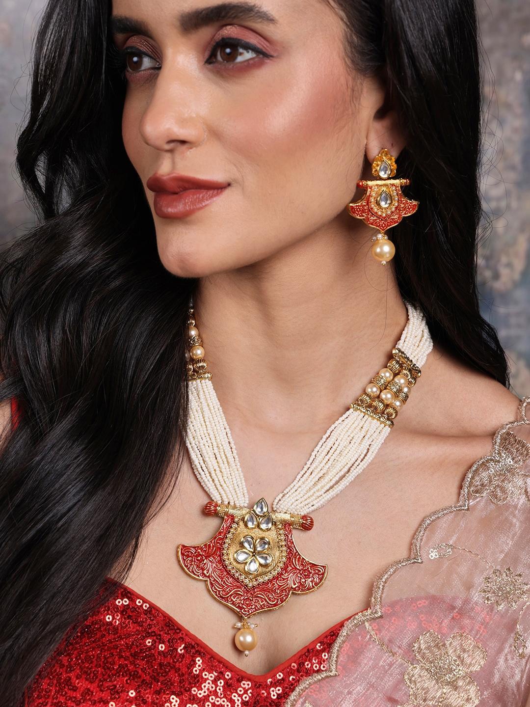 

PANASH Gold-Plated White & Red Handcrafted Kundan-Studded & Beaded Jewellery Set