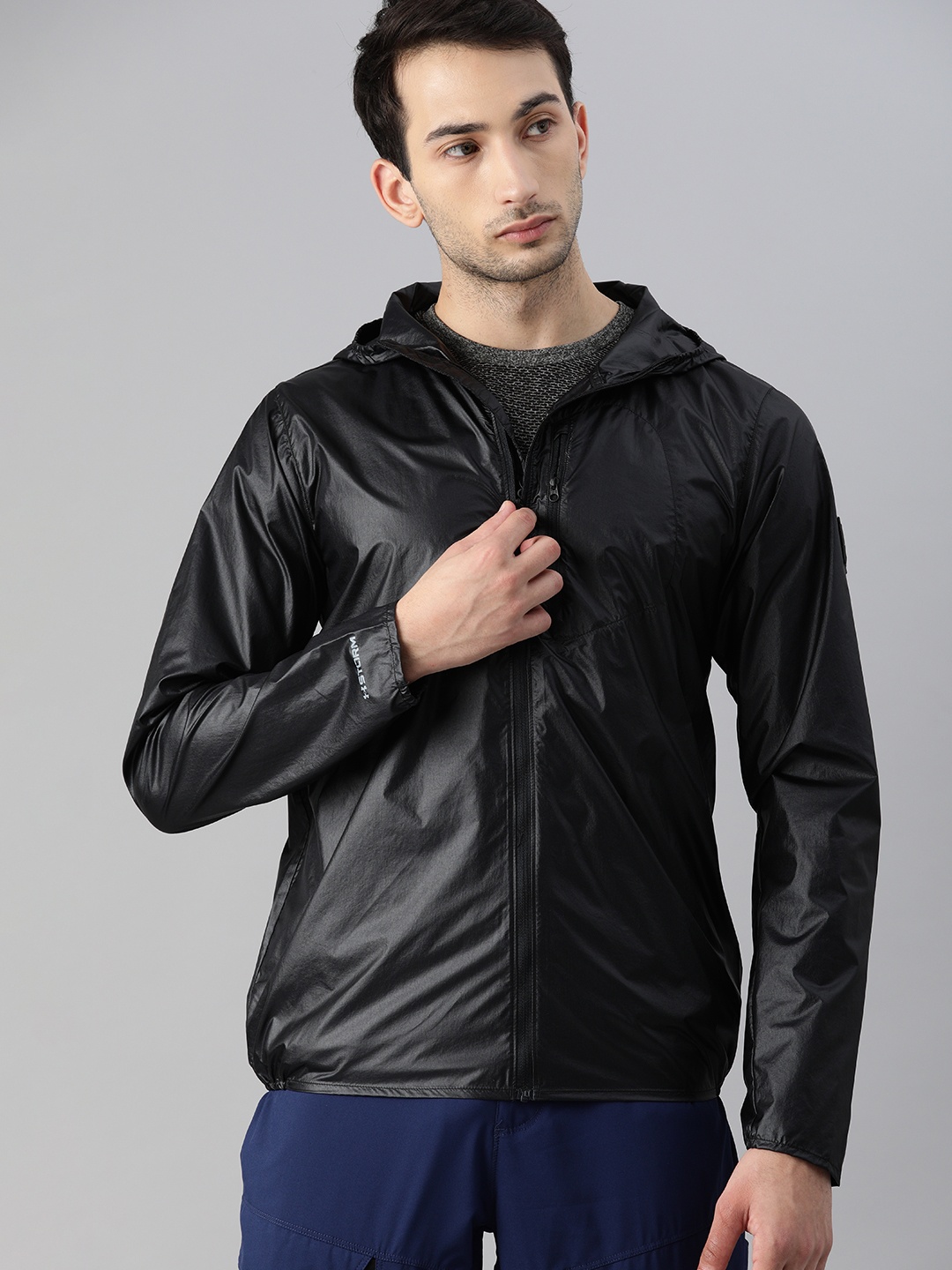 

UNDER ARMOUR Men Black Windcheater and Water Resistant Running Sporty Jacket