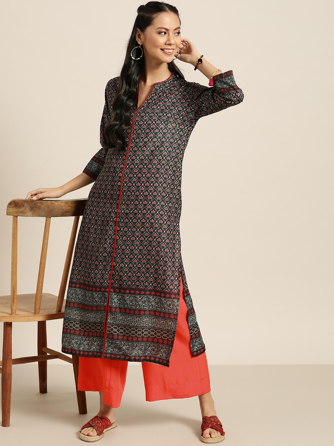 

Sangria Women Black & Coral Red Ethnic Motifs Printed Kurta with Solid Palazzos