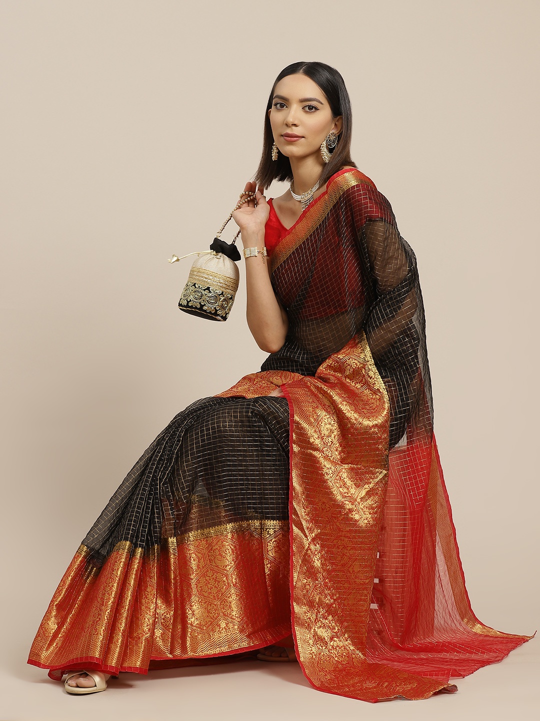 

Anouk Black & Golden Checked Organza Mysore Silk Saree