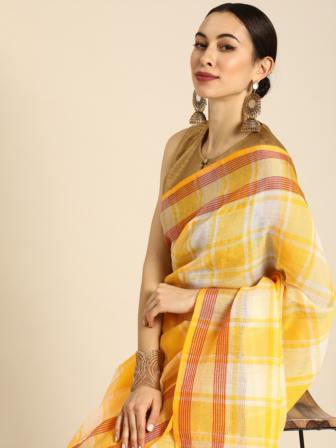 

Anouk Yellow & White Cotton Blend Checked Saree