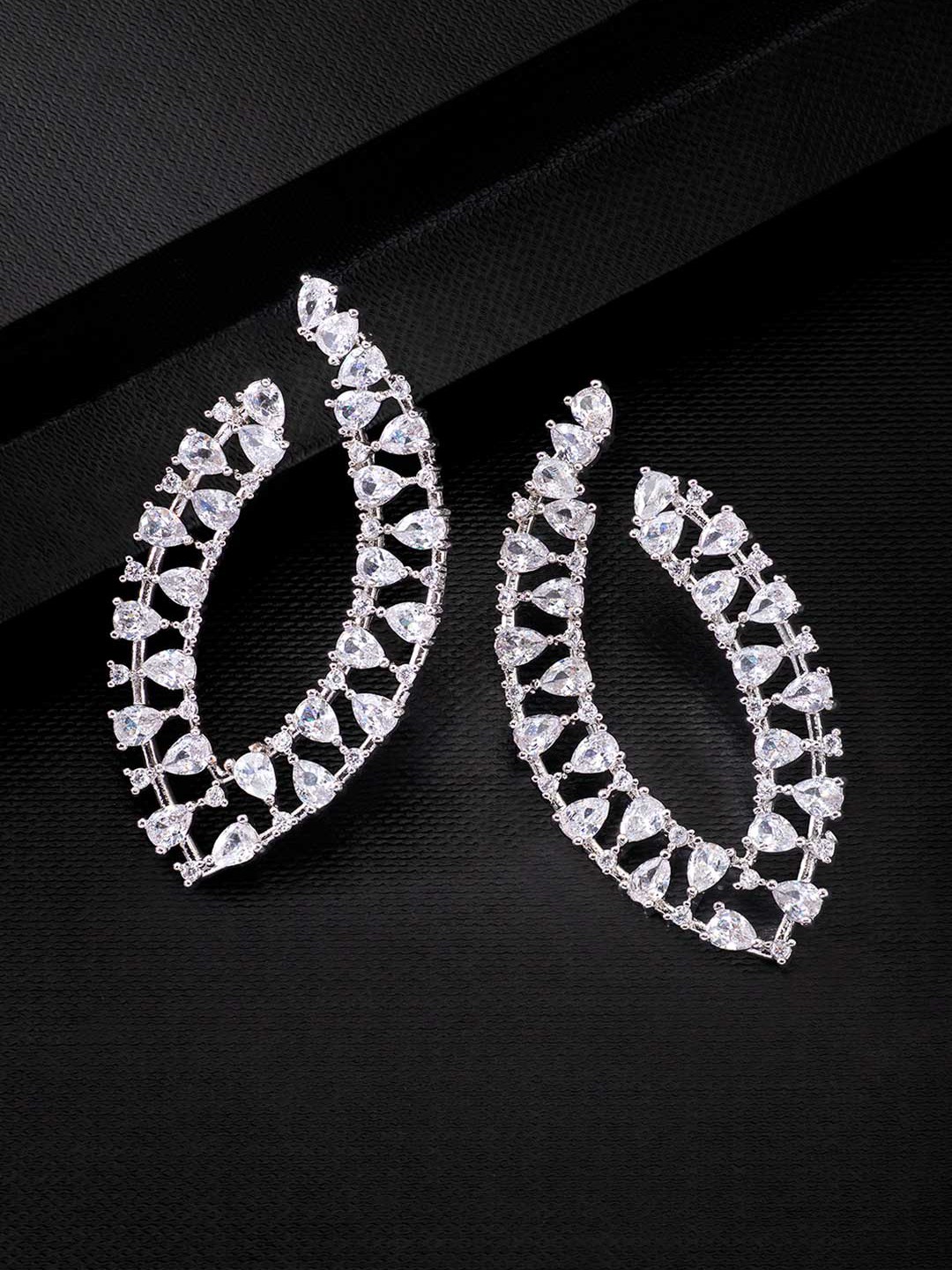 

Peora White & Silver-Plated Cubic Zirconia Studded Contemporary Studs