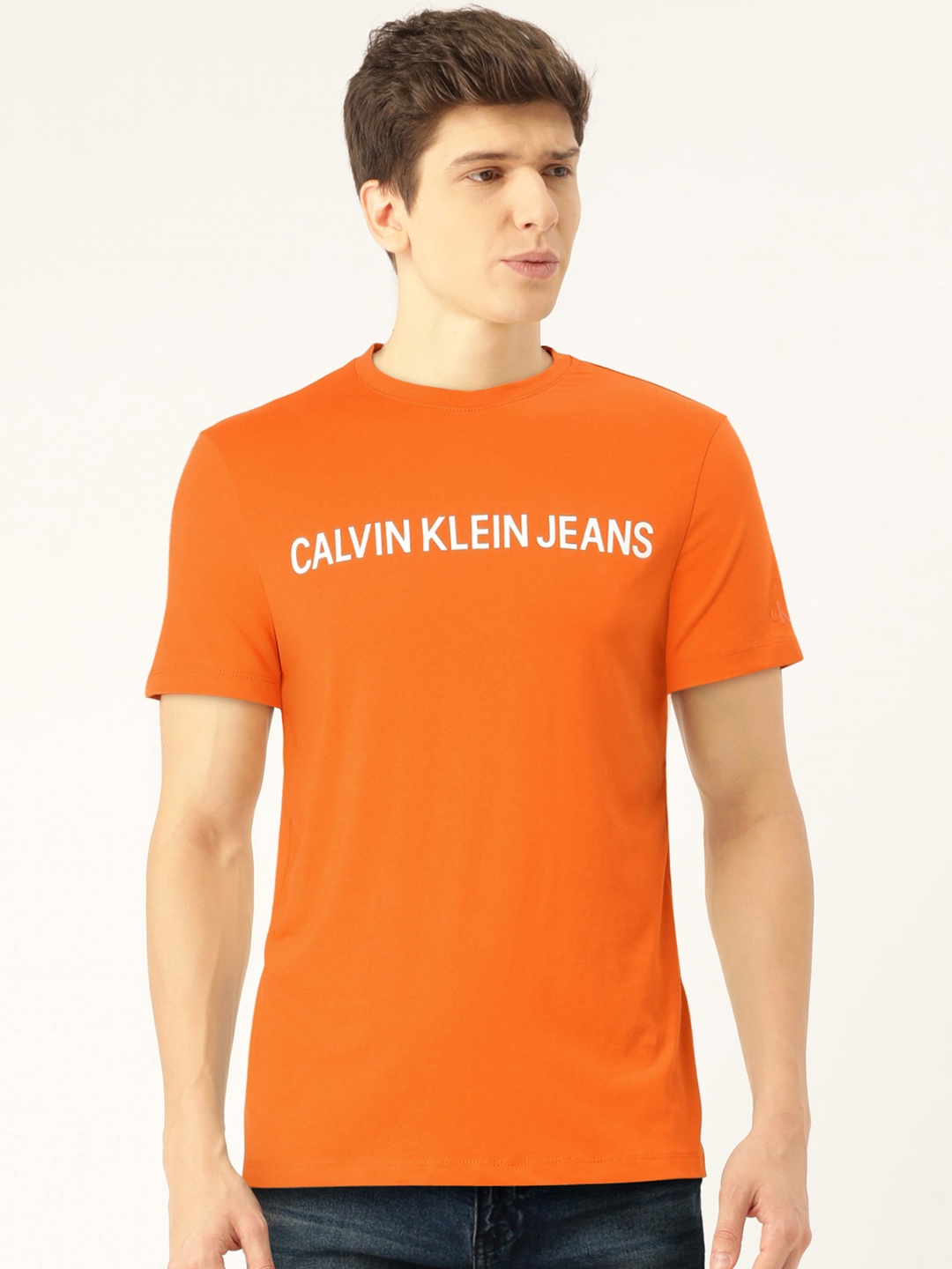 

Calvin Klein Jeans Men Orange Solid Slim Fit Round Neck T-shirt