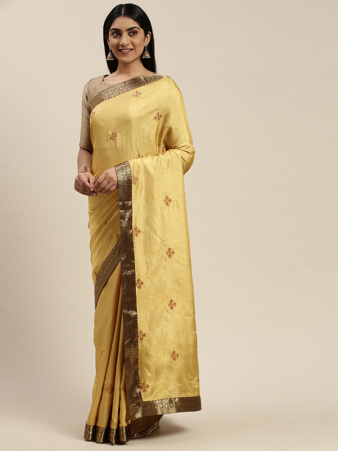 

Indian Women Gold-Toned Embroidered Saree