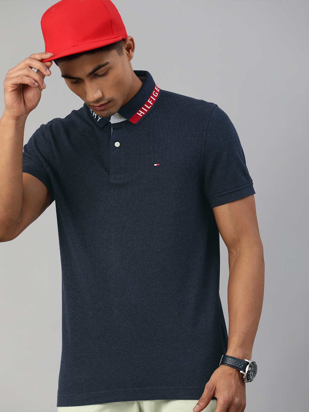 

Tommy Hilfiger Men Navy Blue Solid Polo Collar Pure Cotton T-shirt with Logo Print