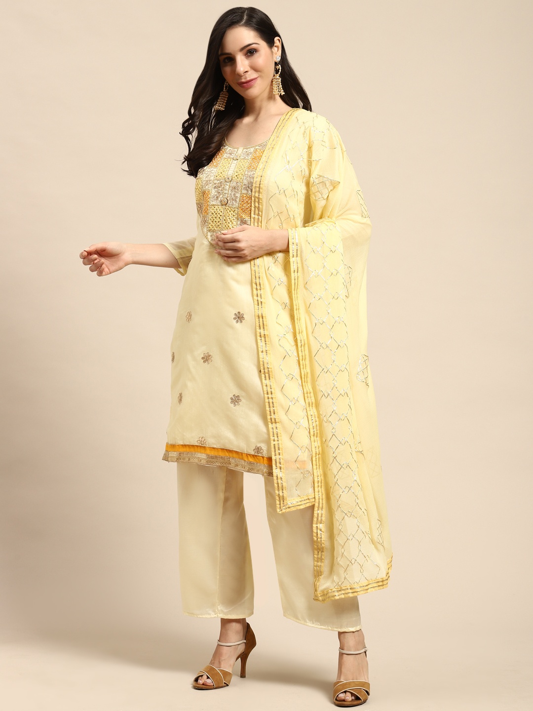 

Rajnandini Yellow & Golden Embroidered Semi-Stitched Dress Material