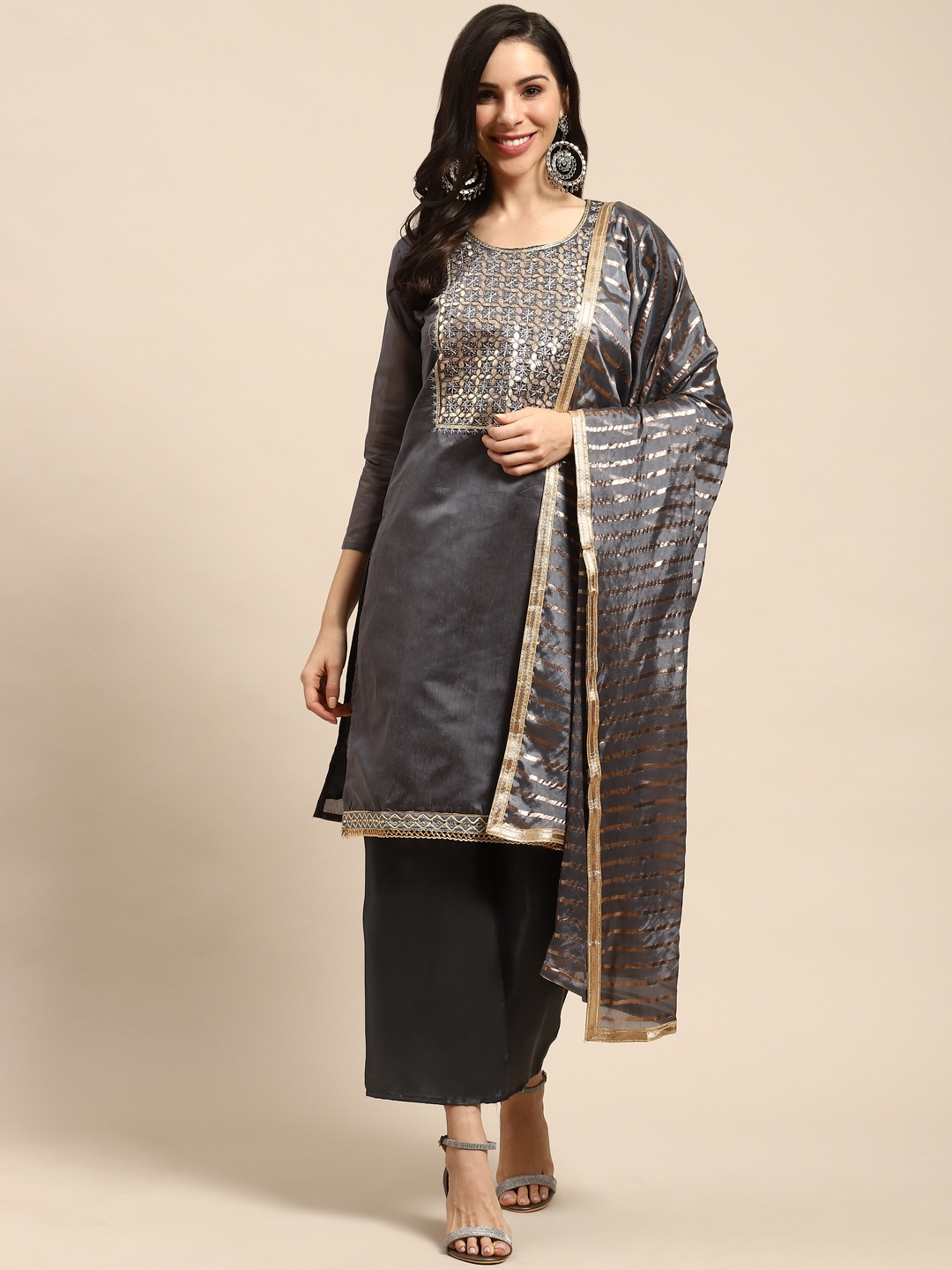 

Rajnandini Charcoal Grey & Golden Embroidered Semi-Stitched Dress Material