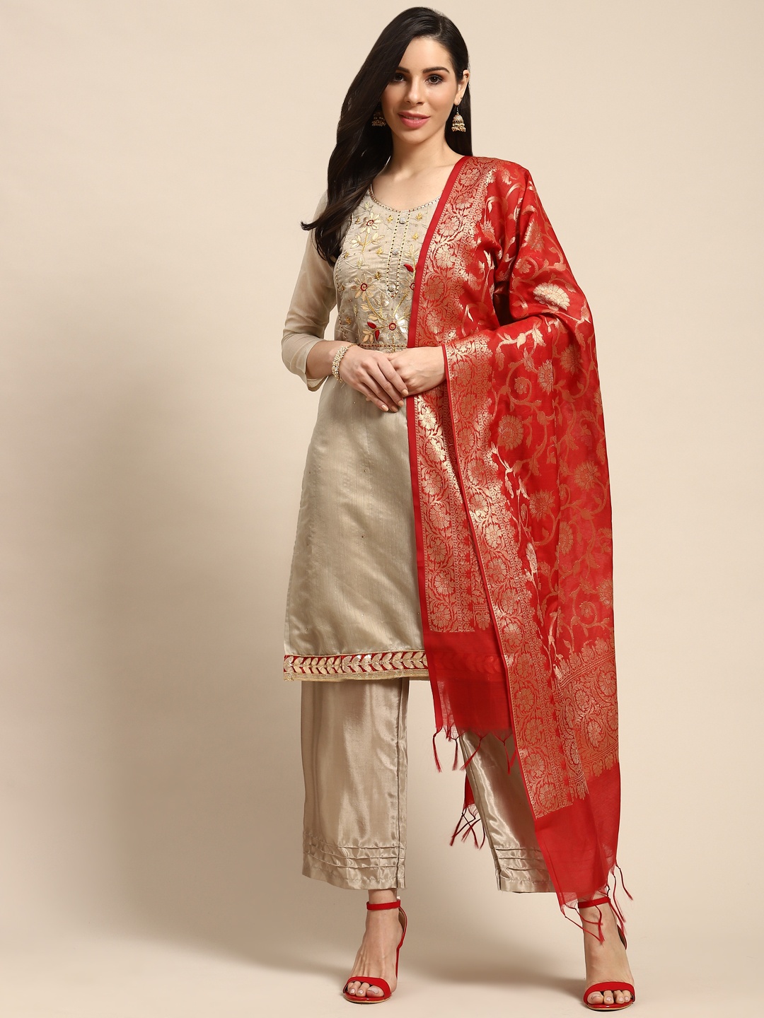 

Rajnandini Beige & Golden Embellished Semi-Stitched Dress Material