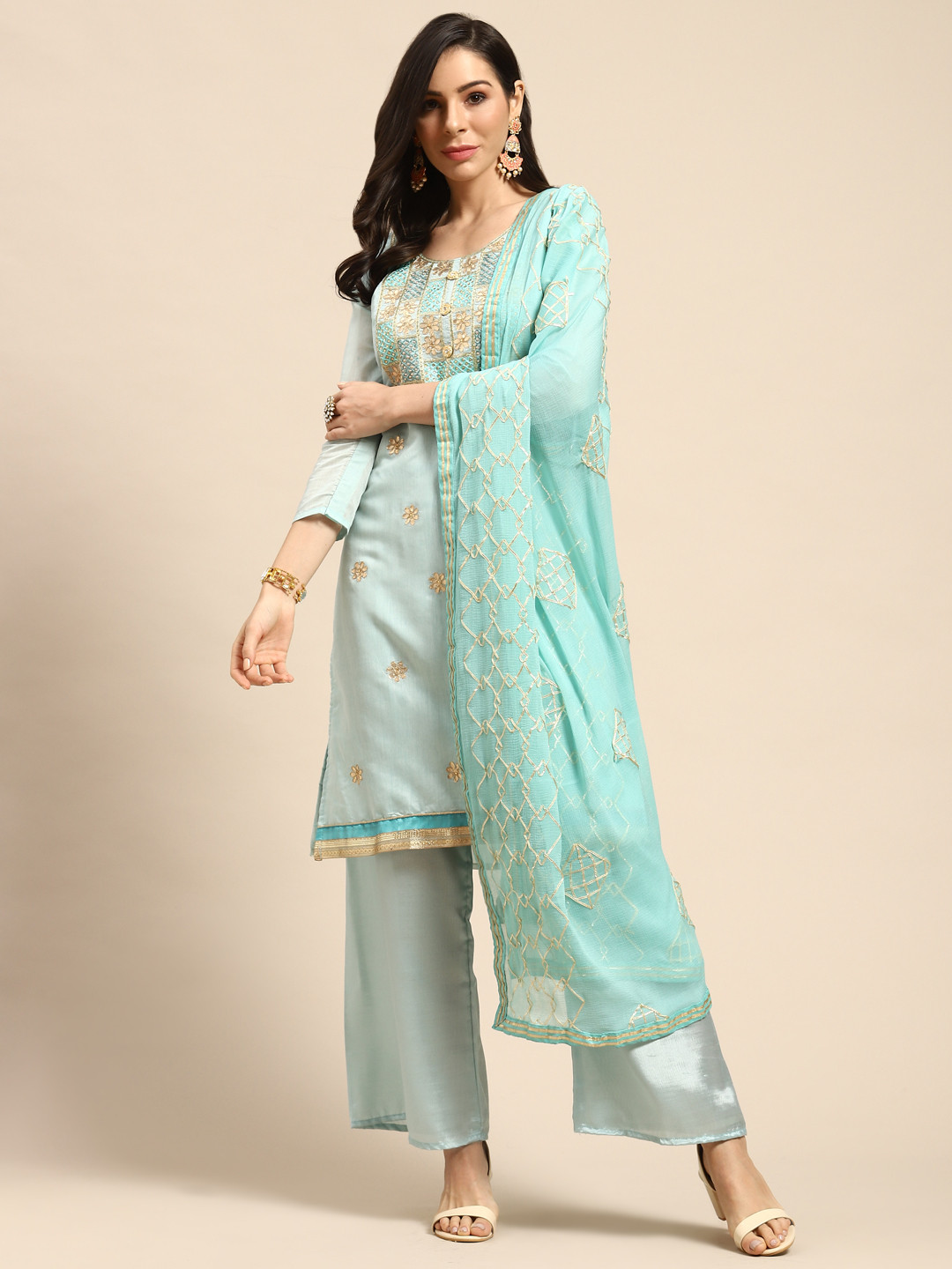 

Rajnandini Turquoise Blue & Golden Embroidered Semi-Stitched Dress Material