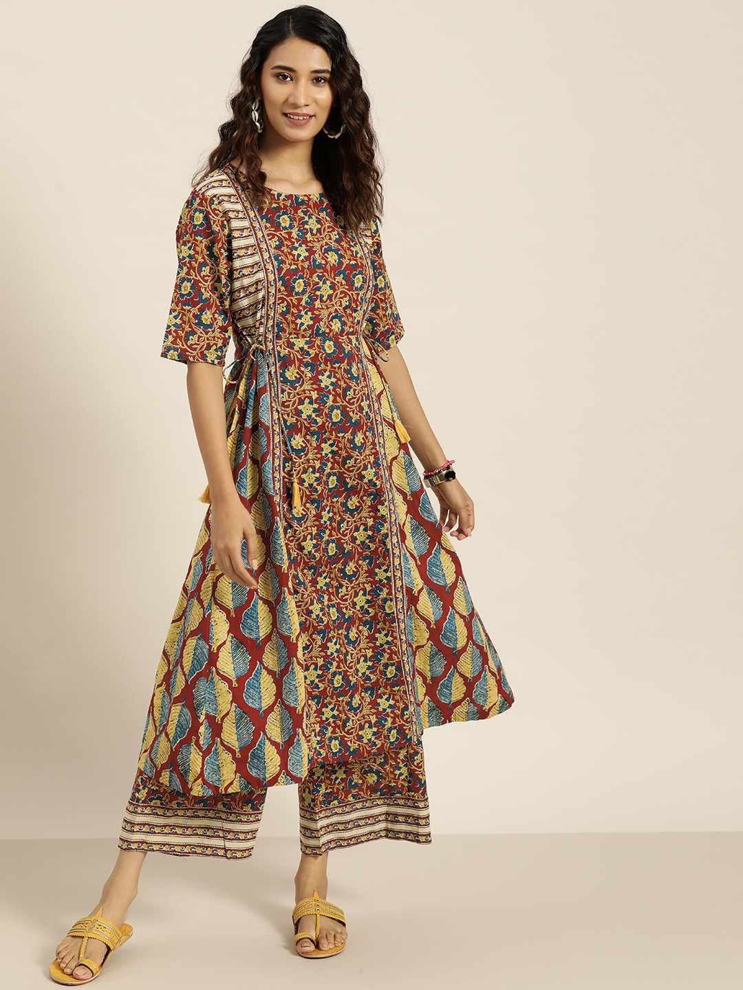 

Sangria Women Maroon & Mustard Yellow Motifs Print Panelled Cotton Kurta with Palazzos