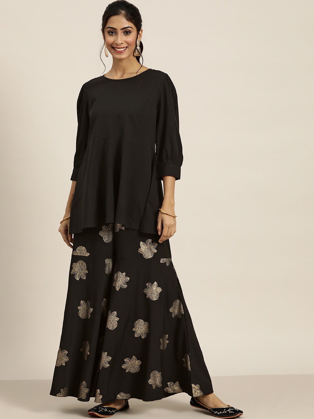

Sangria Women Black & Golden Ethnic Motifs Printed Regular Kurti with Sharara