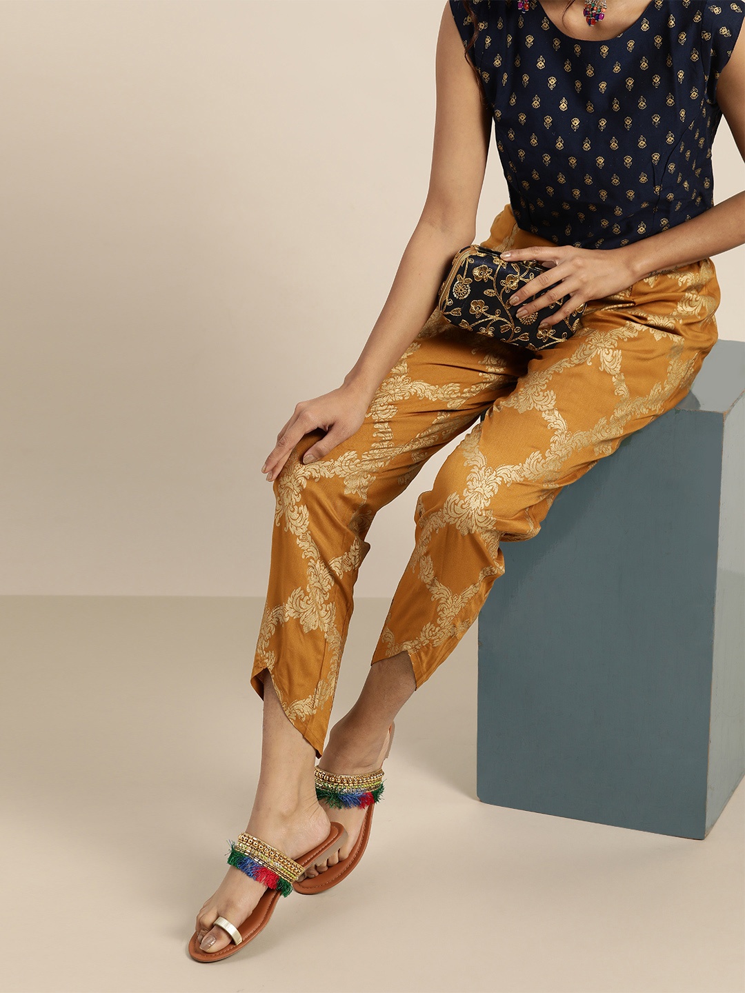 

Shae by SASSAFRAS Women Mustard Yellow & Golden Regular Fit Foil Printed Trousers
