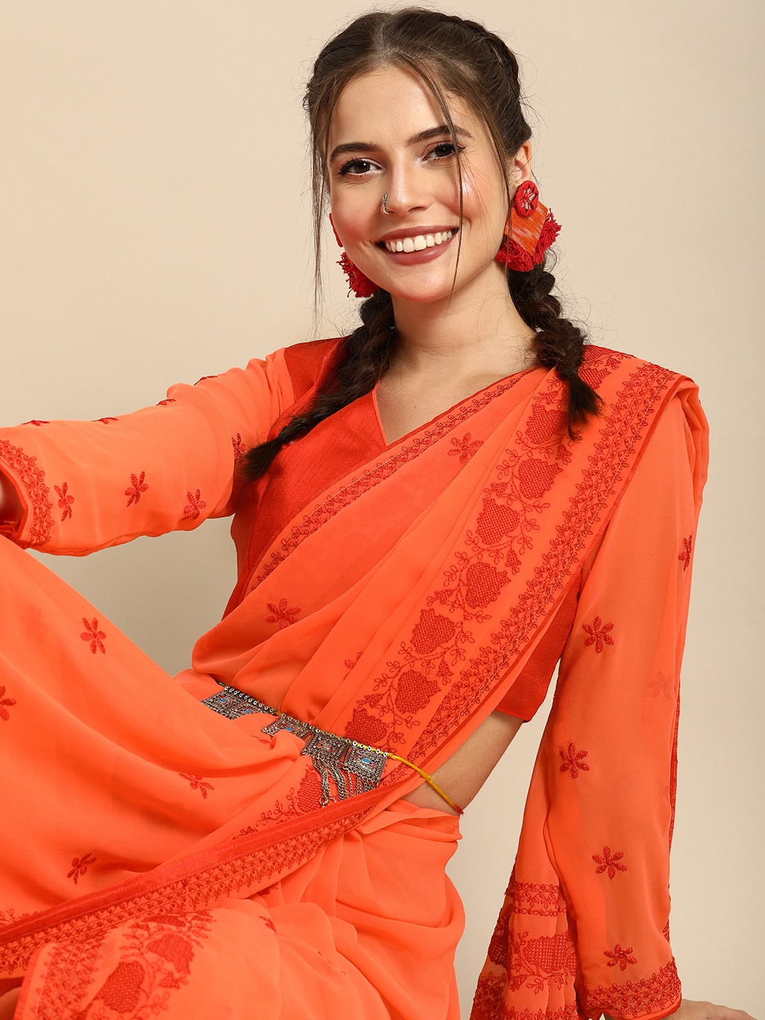 

Sangria Orange Embroidered Pure Georgette Saree