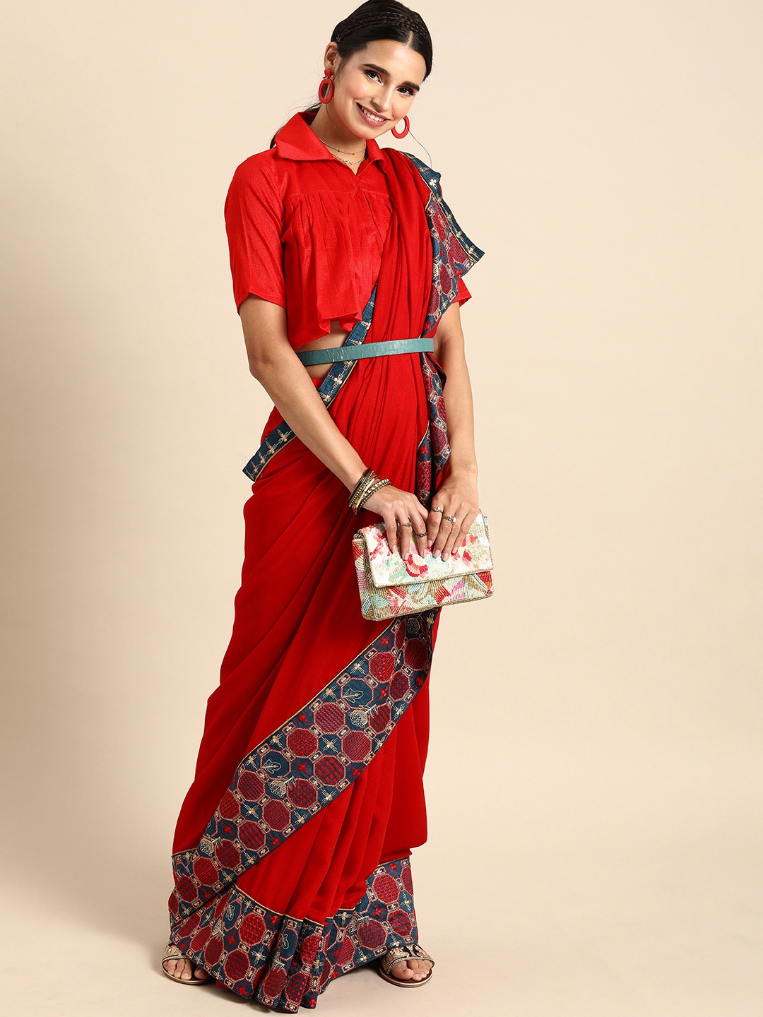 

Sangria Red & Beige Solid Saree