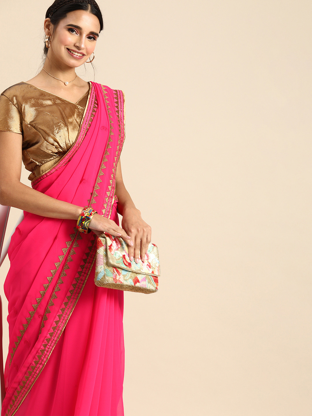 

Sangria Pink & Golden Pure Georgette Embroidered Saree