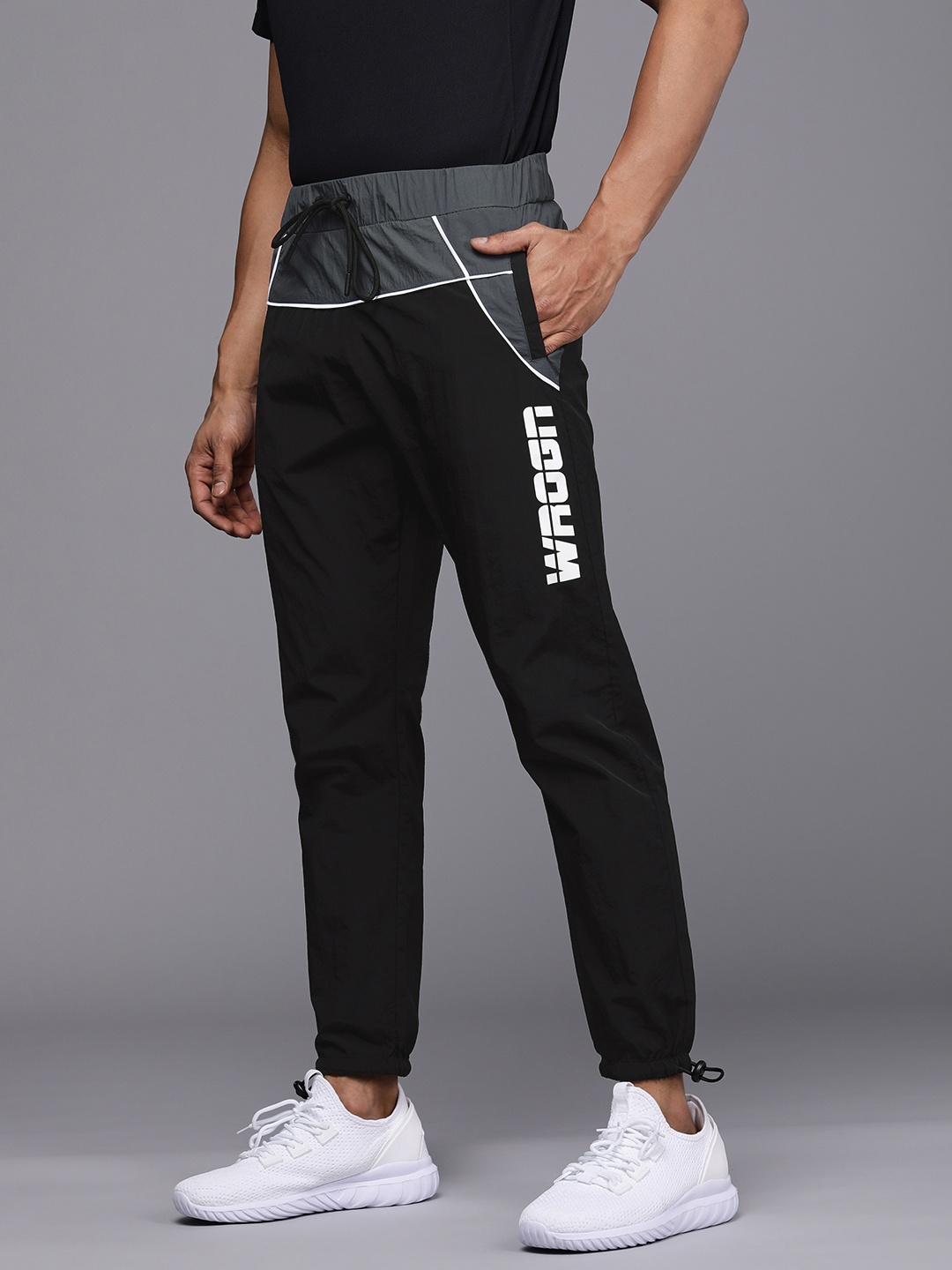 

WROGN ACTIVE Men Black Brand logo Printed Mid Rise Joggers With Toggle hem