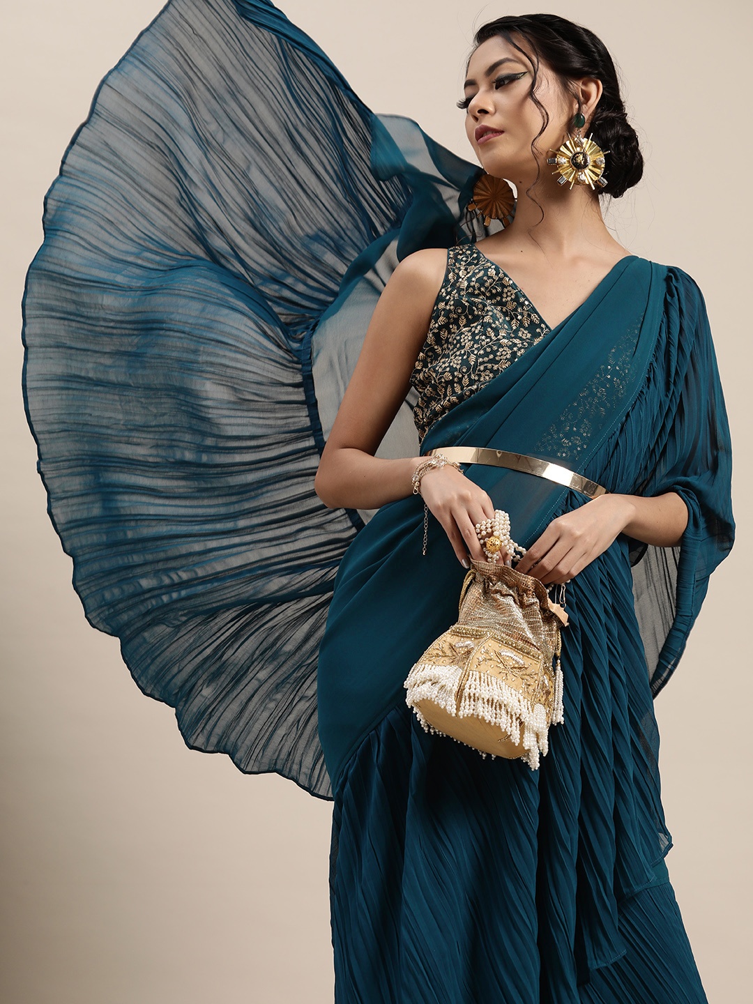 

Inddus Teal Blue Solid Accordian Pleat Ruffles Saree with Embroidered Blouse