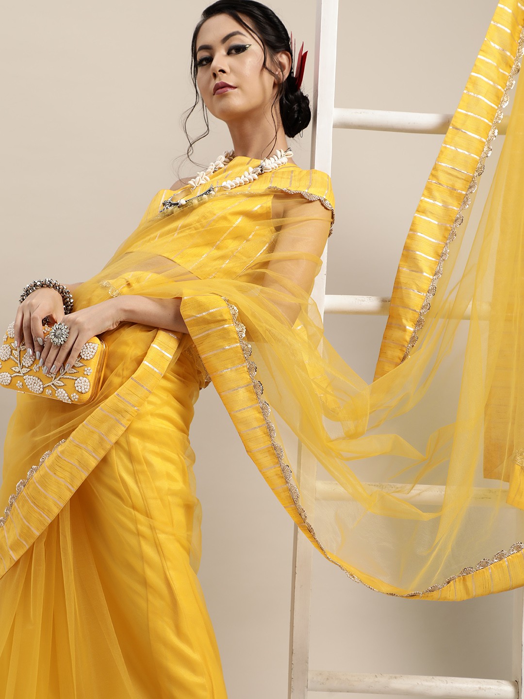 

Inddus Mustard Yellow & Golden Solid Gotta Patti Net Saree