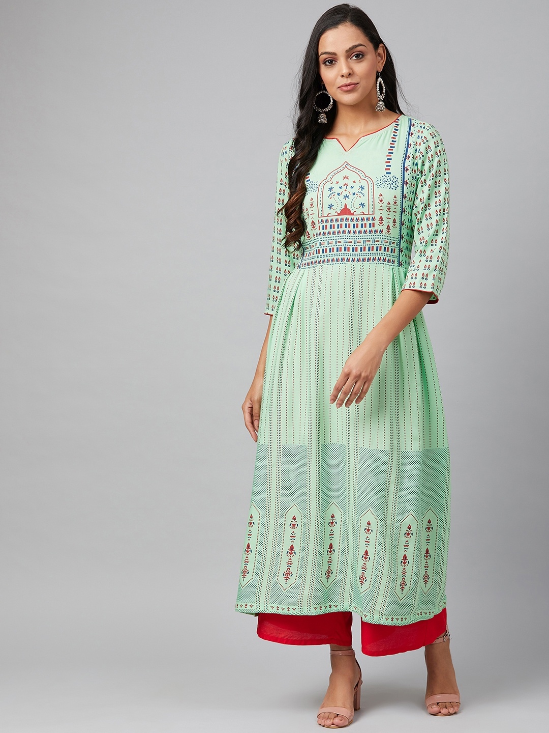 

Tulsattva Women Green & Red Block Printed Kurta with Palazzos